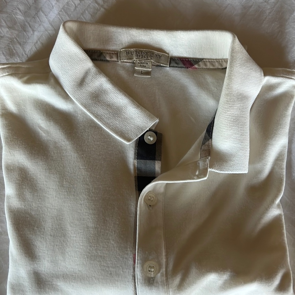 Burberry polo shirt . Short sleeve in off white .